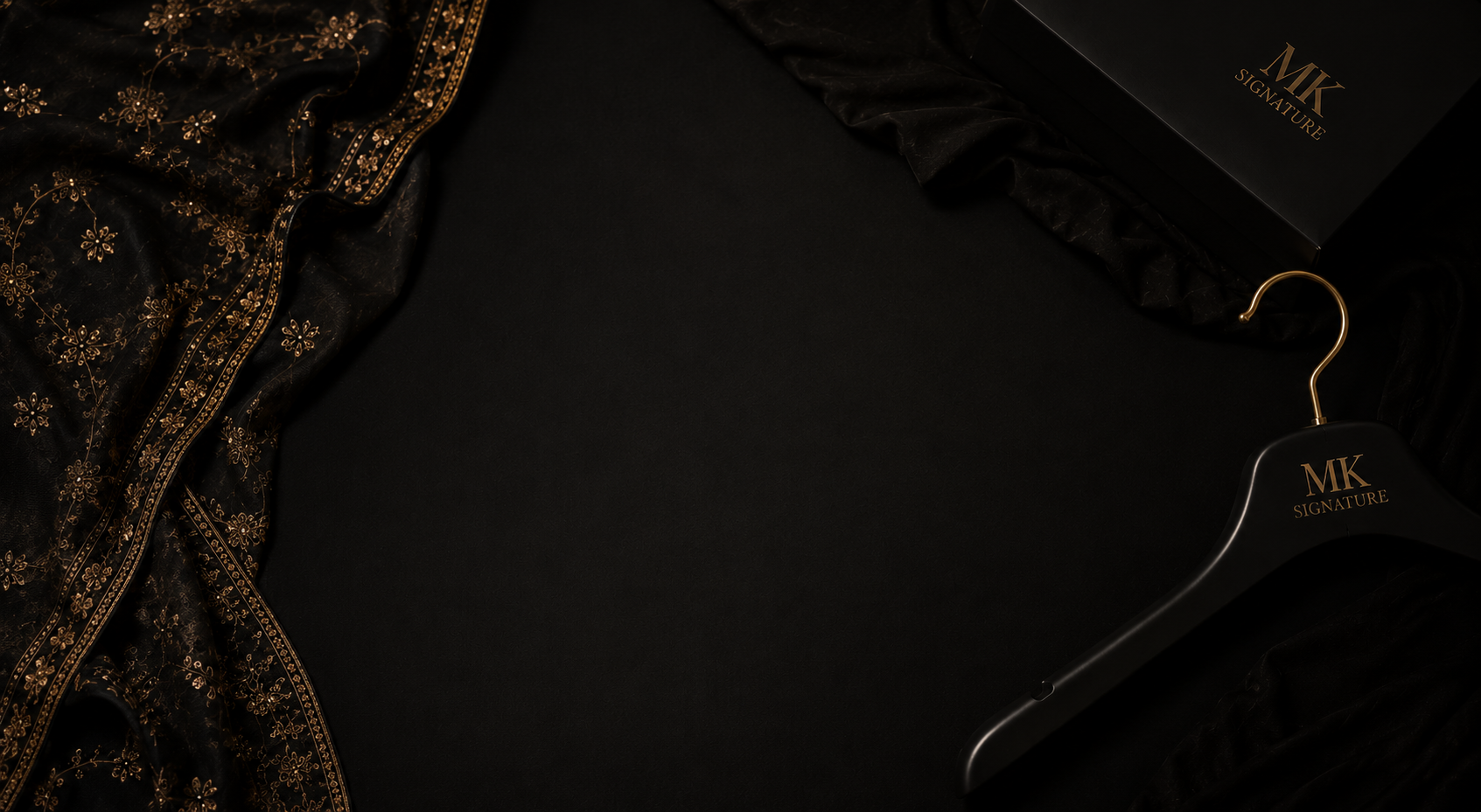Black and gold MK Signature garment details with branded hanger